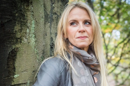 Jane Browne leaning against a tree